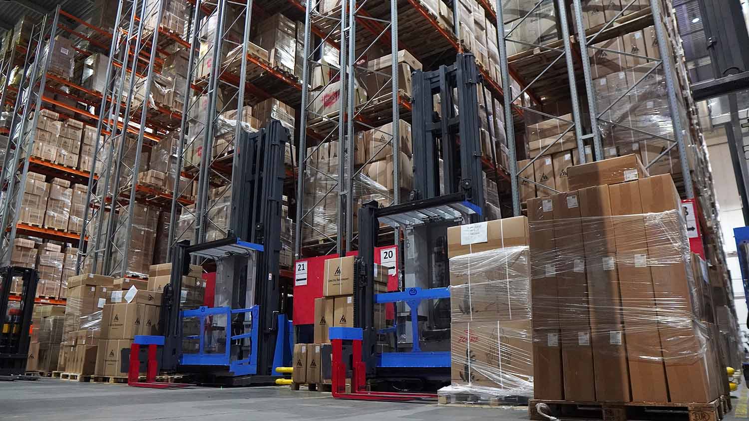 Client Case|Zowell Very Narrow Aisle forklift man up type VUE model helps European head furniture company achieve high density storage